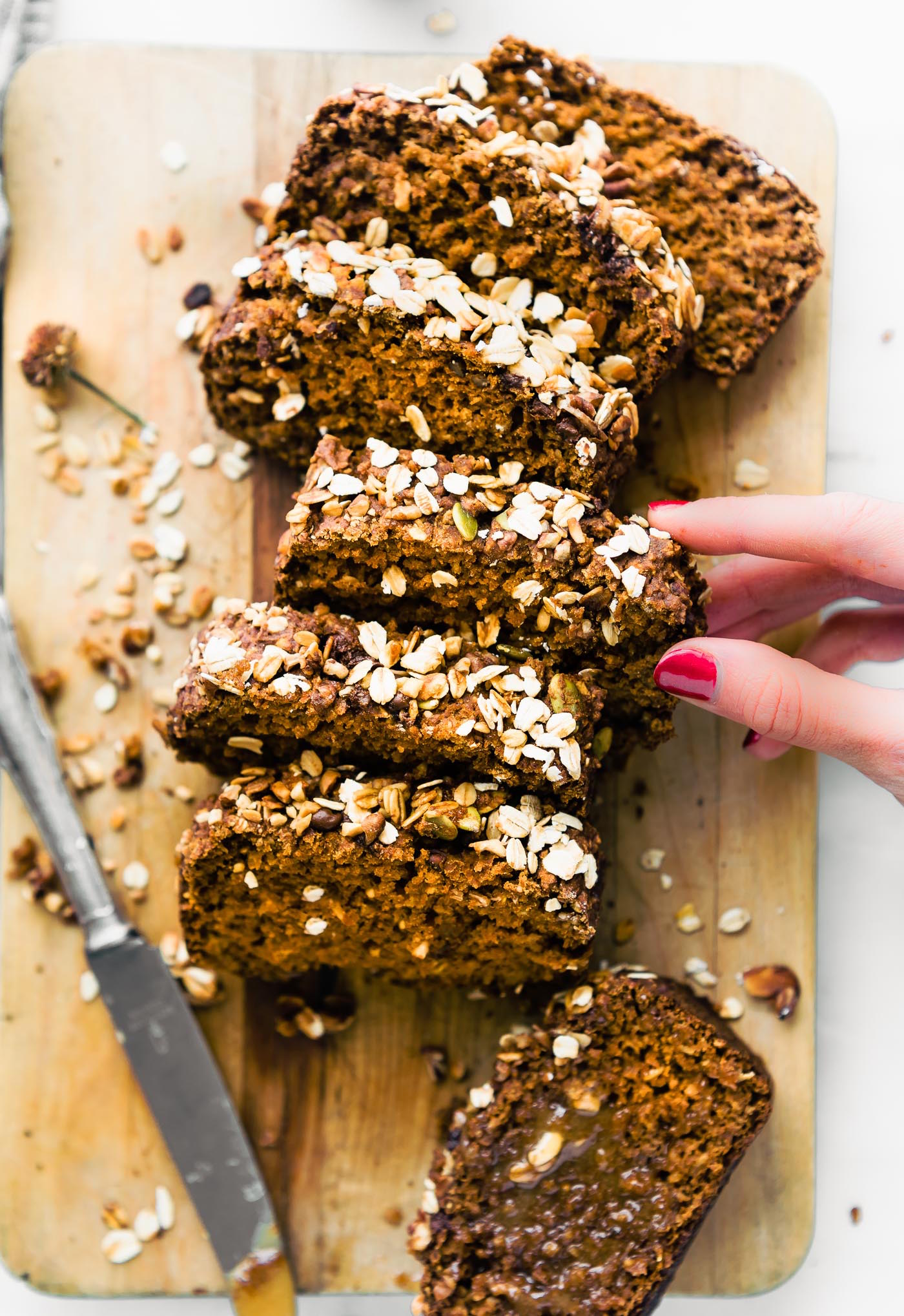 homemade gluten free pumpkin bread, cut into slices on a cutting board