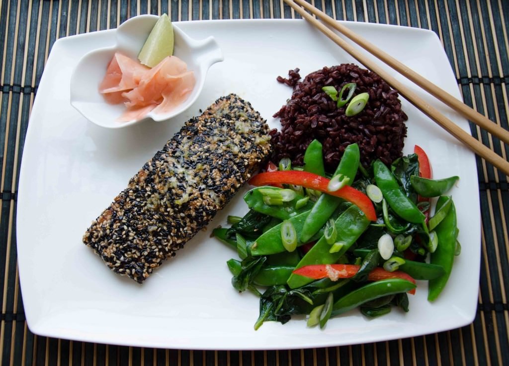 Asian Style Sesame Crusted Salmon with ginger garlic dressing. A refreshing ginger dressing compliments this Asian Style Salmon! Perfect as we transition into spring! Easy to make, full of omegas, and of course, gluten free!. Paleo friendly