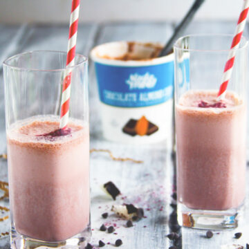 This Almond Joy smoothie recipe is vegan, gluten free, and tastes just like an Almond Joy candy bar, only it's better for you. An ice cream smoothie with vegan chocolate almond ice cream, strawberries, and coconut. The perfect healthy substitute for a milkshake, too!