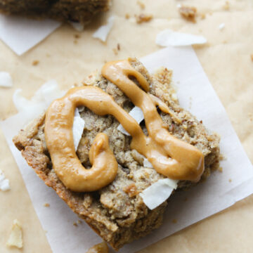 A simple, delicious grain free trail mix blondie bar made with dried fruit, nuts, honey/coconut sugar, and nut butter! Naturally sweetened, easy to make, and perfect for travel, snacks, breakfast, or a healthy dessert alternative!