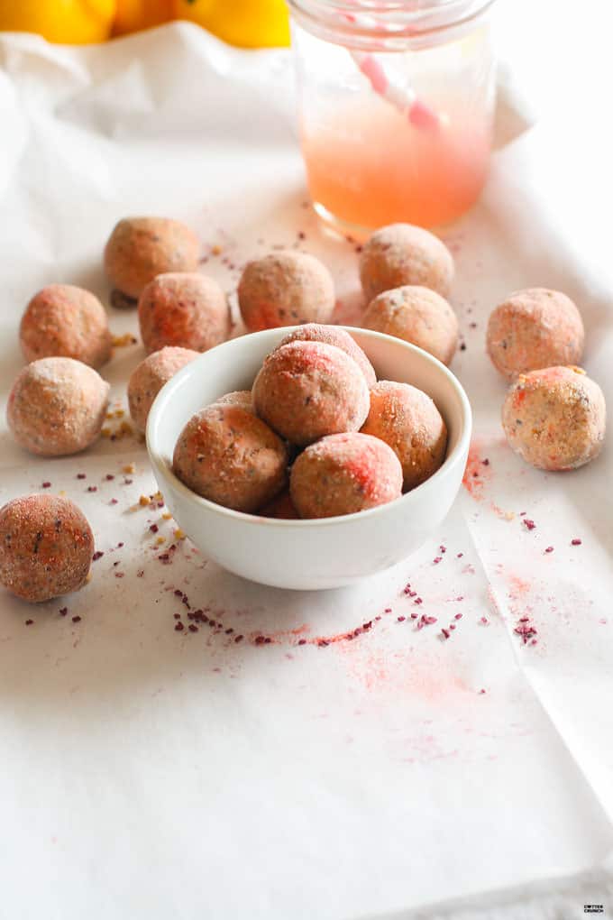 Grain Free Kid friendly Pink Lemonade Protein bites! Lemonade is Summer staple in many homes these days and these refreshing protein bites just might be another a great addition! Lower sugar, protein packed, dairy free, no bake, and Vitamin C rich! Great for snacking on the go, between sports and activities, or anytime of day!