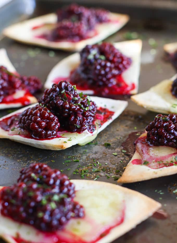 Gluten free Blackberry Basil Nachos. This vegetarian dish is amazingly delicious, protein packed, kid friendly, healthy, and ready in 20 minutes or less. Perfect for snacking, a post workout recovery snack or light meal, or even a fun appetizer!