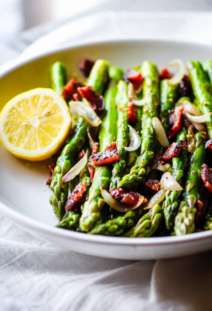 Easy Peppered Candied Bacon and Asparagus It's paleo, gluten free, and super simple to make! Bacon and Asparagus; a side dish match made in heaven.