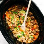 Sweet and sour Hawaiian beef in black crockpot.