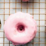 Gluten Free Strawberry Baked Donuts. Healthy Donuts do exist! These gluten free and protein packed baked donuts are super easy to make and great for kids, a sweet breakfast, or even just to snack on. Can you believe one of these strawberry baked donuts has better nutrients and health perks than a plain old energy bar. #blenderrecipe #donuts #healthy #glutenfree #dairyfree