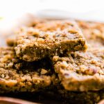 Baklava bars arranged together on shallow bowl.