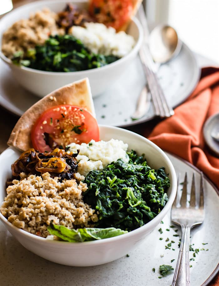 Gluten Free Homemade Pizza Bowls! These Easy homemade Pizza Bowls are a super fun way to share and customize pizza. Just fill it with all your favorite gourmet pizza toppings! Caramelized onion, goat cheese, spinach, and more! Then scoop with gluten free pizza crust. Simple, healthy, and delicious!!