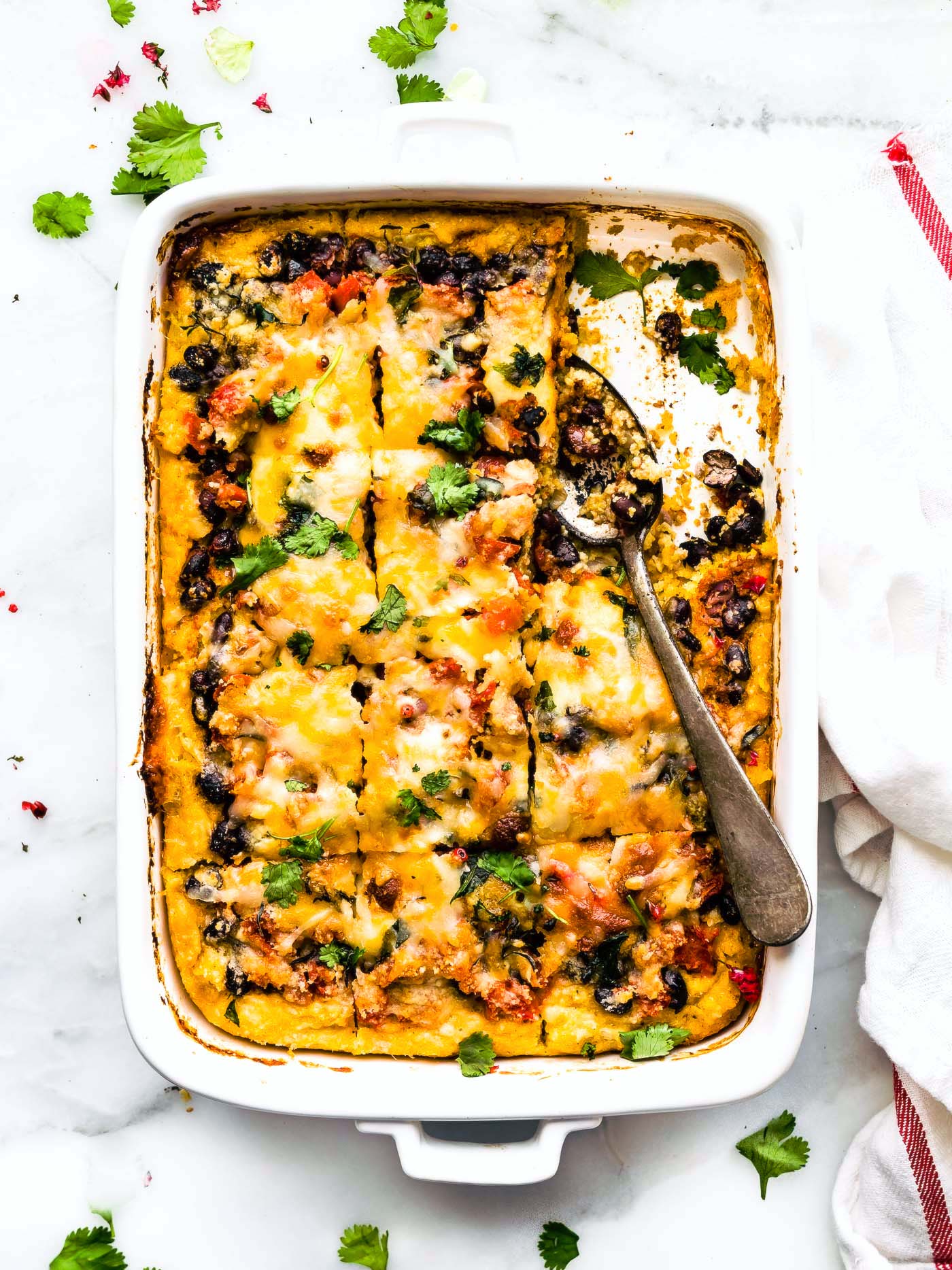Overhead view black bean polenta casserole in a white baking dish