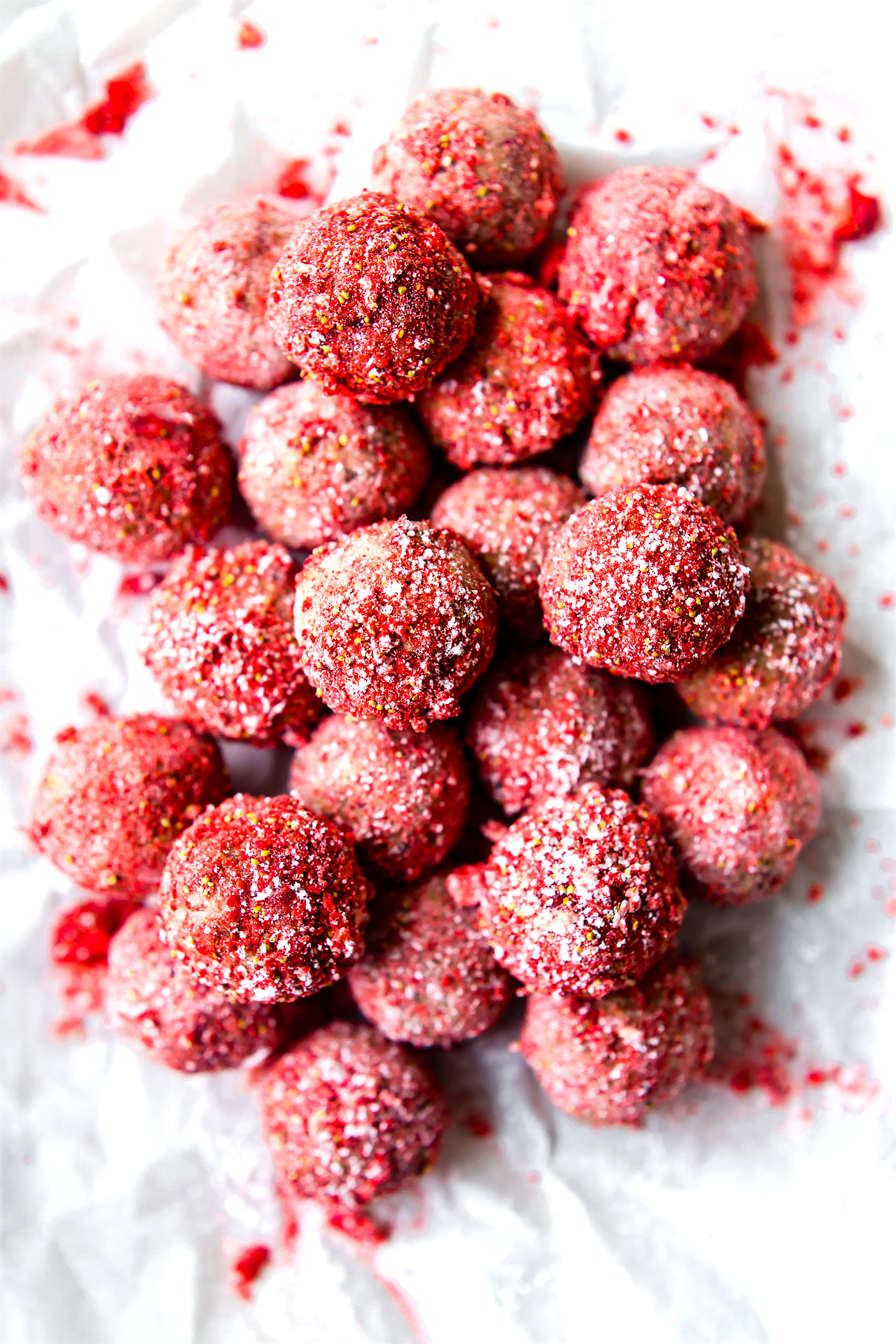These Vegan No Bake Strawberry Cake Bliss Bites are the bite size healthy dessert. Just dried Strawberries, cashew cream, gluten free granola/flour, and a sweet jam filling! Tart and tasty! A vegan cake bite that requires no baking, just blissfully nourishing. Paleo friendly.