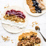 3 breakfast wraps being filled with healthy ingredients like blueberries, almond butter, oatmeal, and brown rice