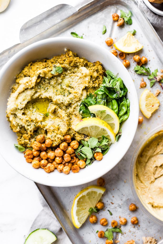 This Warm Mediterranean Spinach Artichoke Hummus Dip is a meal in itself. A vegetarian Mediterranean Baked Hummus Dip that's wholesome and healthy. Simple real food ingredients that you blend and bake! Gluten free, plant based, and delicious.