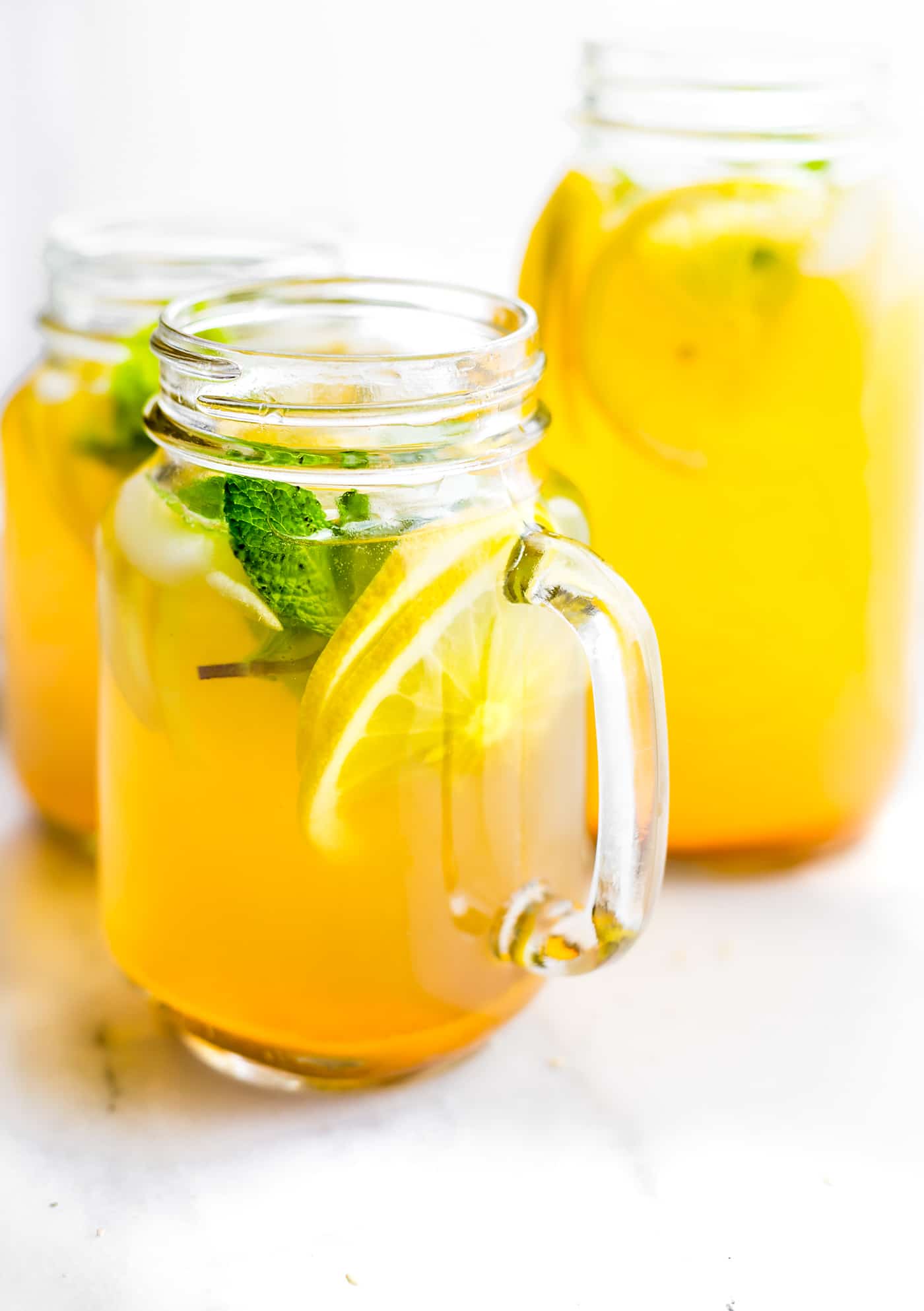 This Turmeric Ginger Lemonade with fresh Mint is great for fighting fatigue and reducing inflammation in the body. It's quick to make, naturally sweetened, and super refreshing! A homemade lemonade with a hint of spice, tartness, and Zing! Vegan, paleo, and AMAZING!