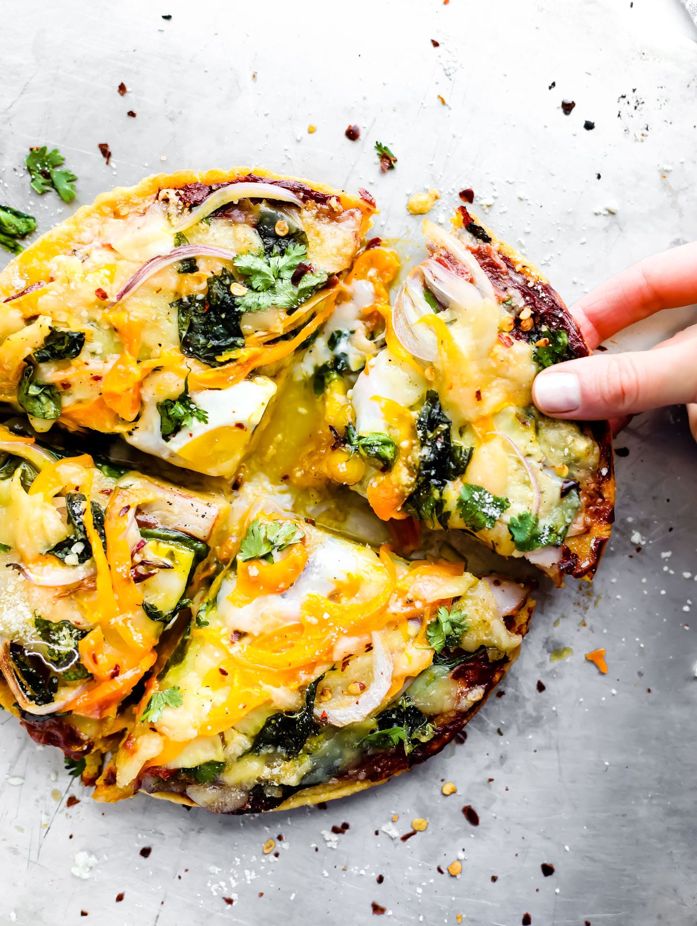 A breakfast pizza recipe you can make for any meal! Socca pizza crust made from just 3 ingredients, sliced pineapple, uncured bacon, egg, onion, and creamy meltable artisan cheese! A breakfast pizza that's quick to make, grain free, and deliciously nutritious. You'll be hooked!