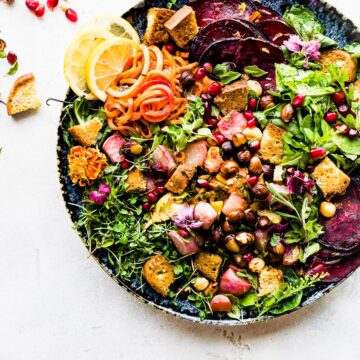 panzanella salad with fall vegetables served on stone bowl.
