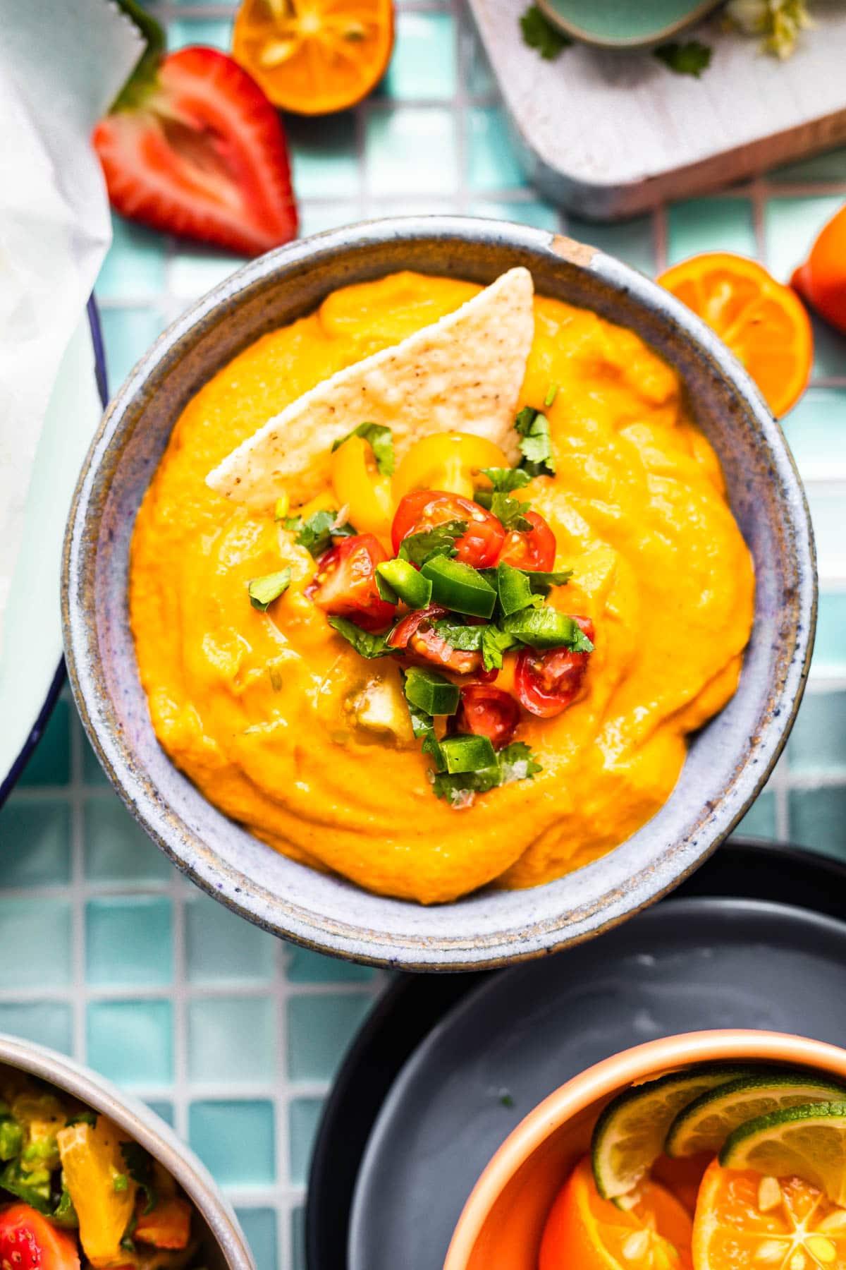 vegan queso + chip in a bowl