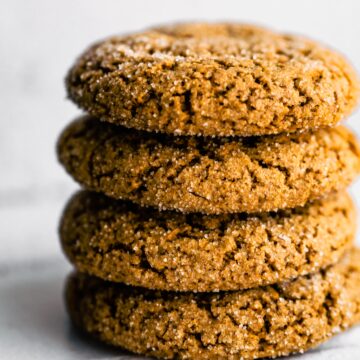 stacked photo of gluten free molasses cookies on white wall