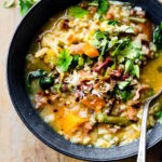 Overhead view Everything But the Kitchen Sink Soup in dark gray bowl
