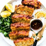 slices of barbecue gluten free meatloaf on a dinner plate