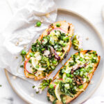 spring salad on top of chargrilled sourdough toast