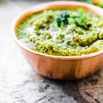 homemade pesto sauce in a copper bowl