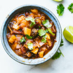 Overhead view blue stone bowl filled with honey peach chipotle salsa.
