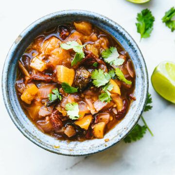 Overhead view blue stone bowl filled with honey chipotle peach salsa