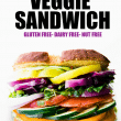 The Ultimate Farmer's Market Veggie Sandwich. It’s all of your favorite seasonal vegetables piled high atop gluten free bread with fresh basil leaves and a vegan pesto.  A nut free and dairy free sandwich recipe perfect for lunch boxes, quick vegetarian dinners. #glutenfree #vegetarian #healthy #dairyfree #sandwich #lunch #mealprep