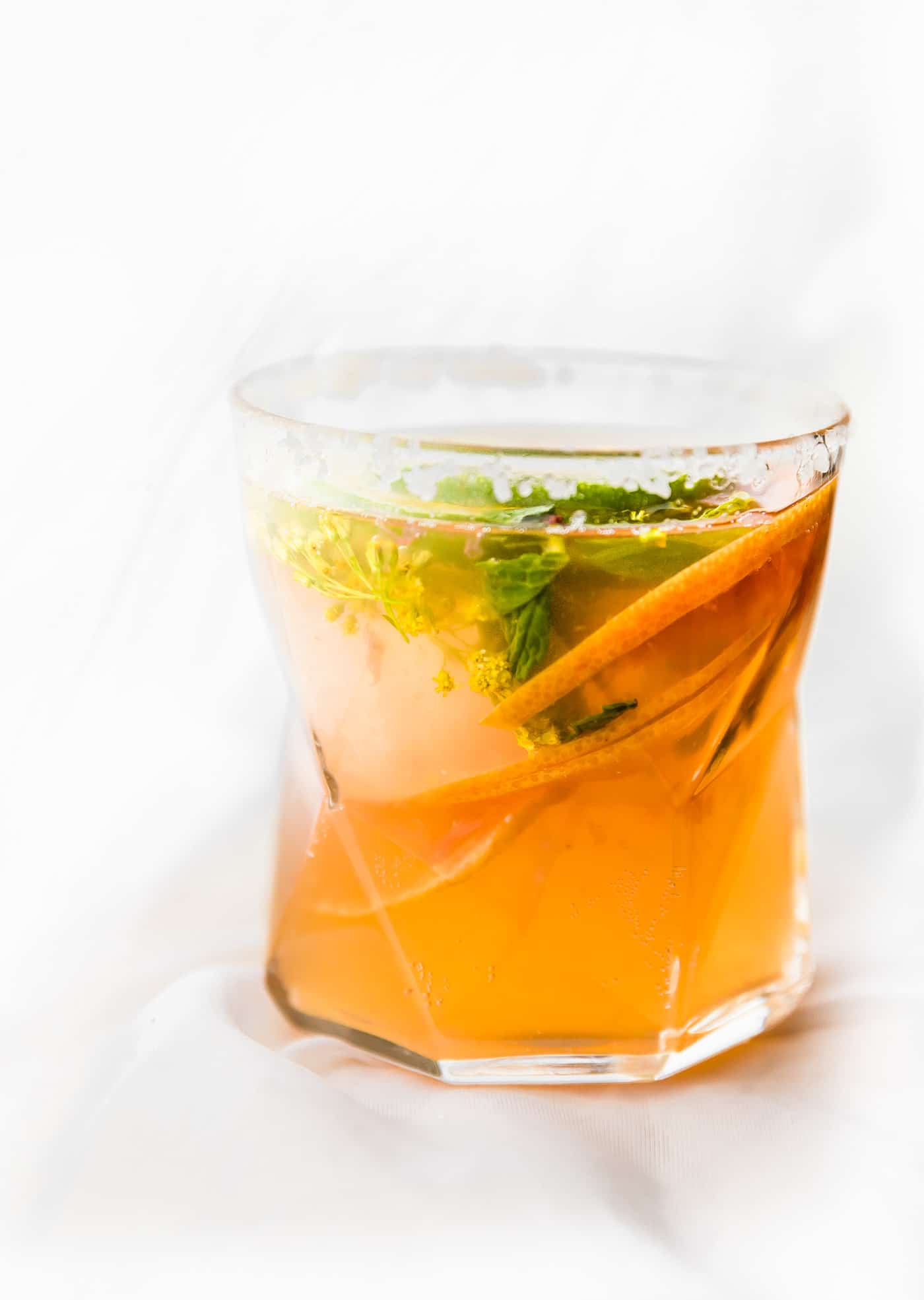 A glass of Citrus Kombucha Mezcal Cocktail