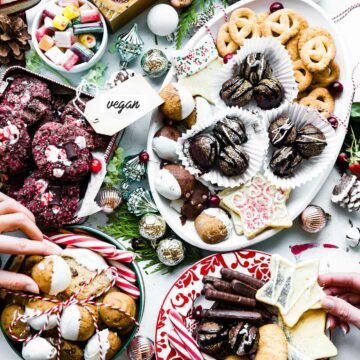 Overhead view white platter filled with an assortment of vegan Christmas cookies