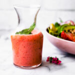 Strawberry vinaigrette dressing in glass carafe