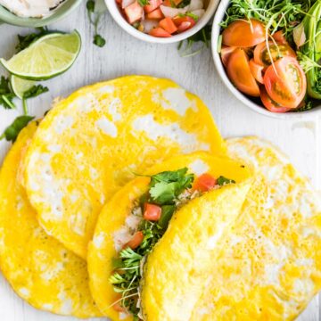 paleo breakfast egg wraps stuffed with fresh vegetables