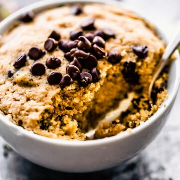 vanilla mug cake topped with chocolate chips.