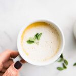 overhead image: mug of hot latte made with bone broth