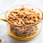 This homemade granola has buckwheat groats and is lightly sweetened with maple syrup. It's a delicious, wholesome anytime snack. Plus, it's perfect for holiday food gifts! Pair it with whatever you’d like-  yogurt, milk, dried fruit, chocolate, etc. Or, eat it by itself! This granola recipe is vegan and refined sugar free. #granola #glutenfree #vegan #homemade