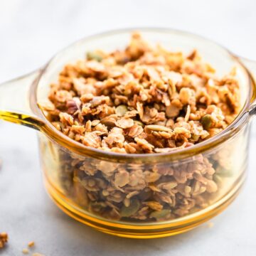 This homemade granola has buckwheat groats and is lightly sweetened with maple syrup. It's a delicious, wholesome anytime snack. Plus, it's perfect for holiday food gifts! Pair it with whatever you’d like- yogurt, milk, dried fruit, chocolate, etc. Or, eat it by itself! This granola recipe is vegan and refined sugar free. #granola #glutenfree #vegan #homemade