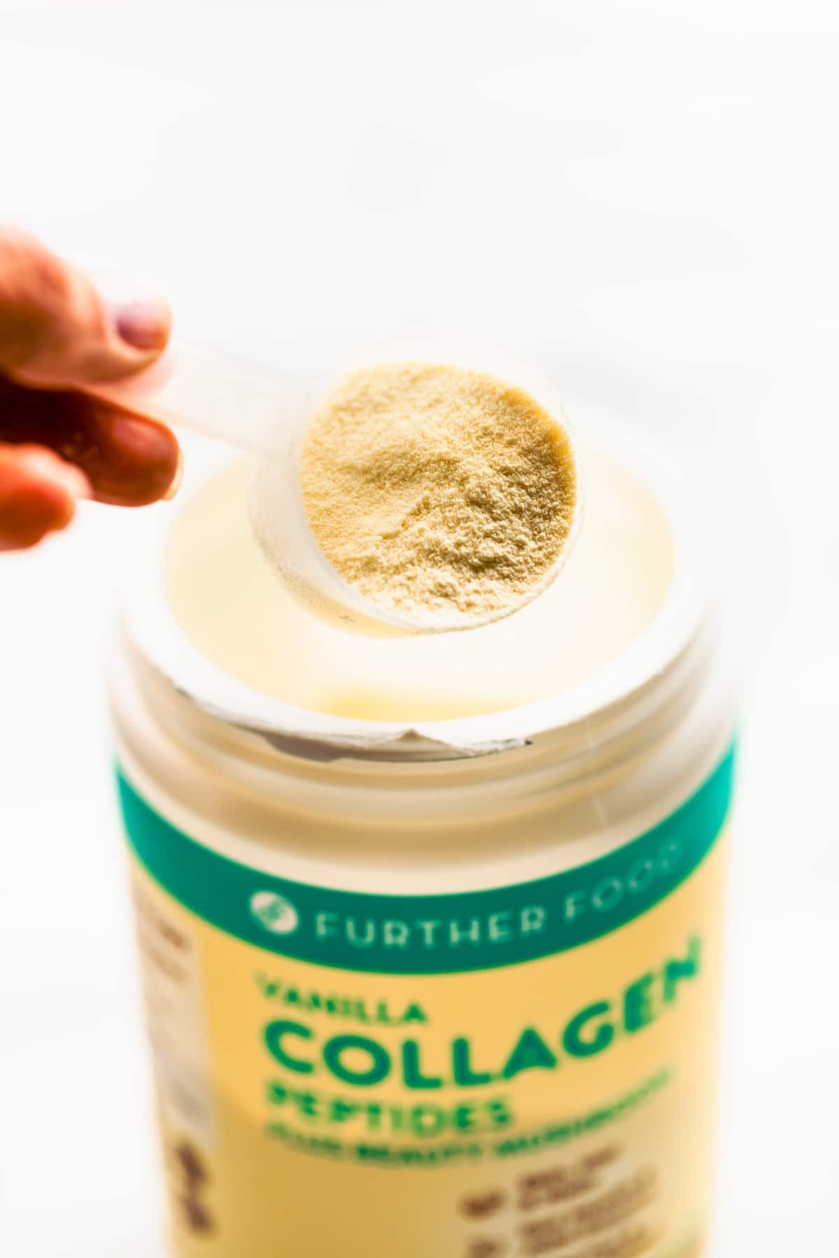 A scoop of vanilla collagen peptides from Further Food.