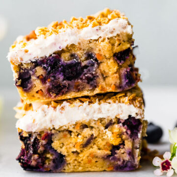 carrot cake bar with berries stacked on top of each other