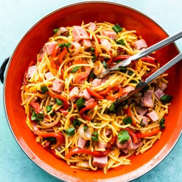 homemade Asian sweet and sour noodles in orange bowl
