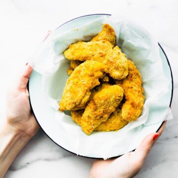 white bowl full of crispy chicken strips