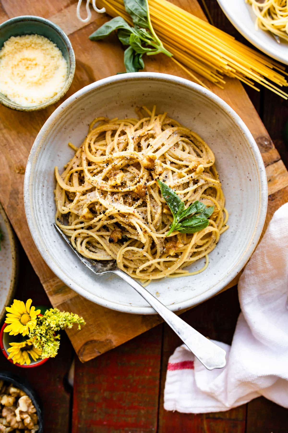 tender spaghetti noodles tossed with vegan pasta sauce in white bowl