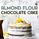 A naked almond flour chocolate cake on a cake stand with a text overlay for pinterest