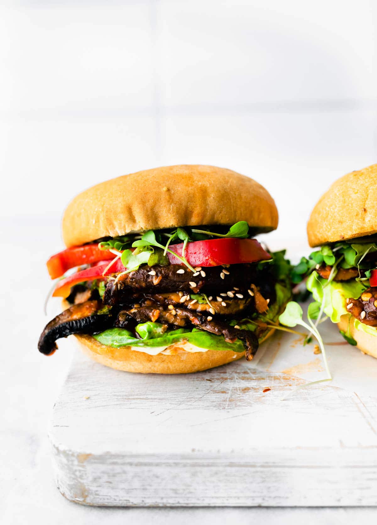 veggie burger with mushroom on white board
