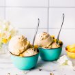 2 robin's egg blue ice cream bowls with spoon and 2 scoops of banana nice cream