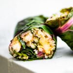 side view shows vegetarian filling inside of Swiss chard salad wraps