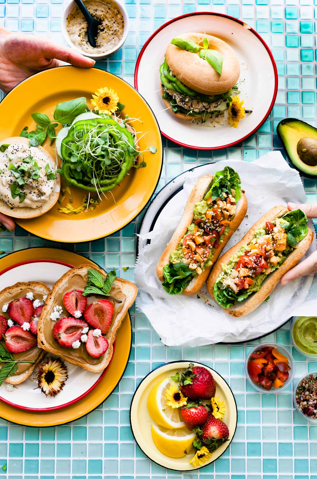 3 vegan sandwiches on colorful plates
