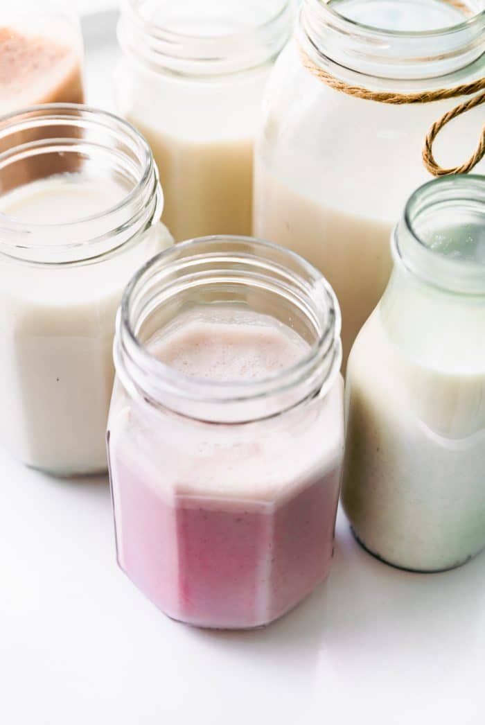 Glass bottles of homemade nut milk