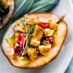 closeup: half of a baked pear with vegan stuffing