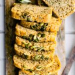 Overhead photo of sliced grain free paleo bread with pumpkin seeds on top.