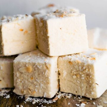 A close-up view of Homemade Coconut Marshmallows with toasted coconut topping.