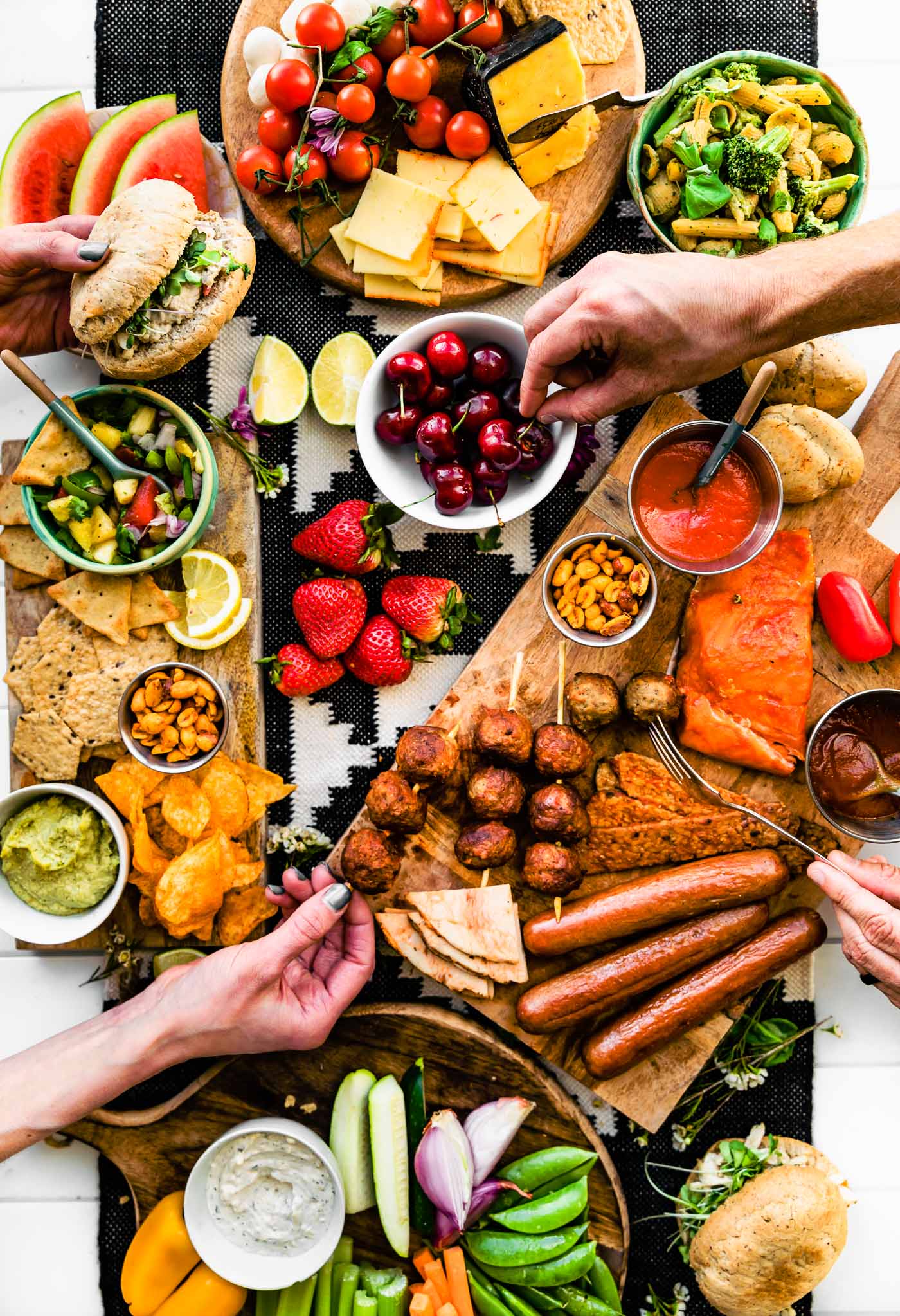 Overhead image of BBQ Graze Board with summer picnic and BBQ dishes